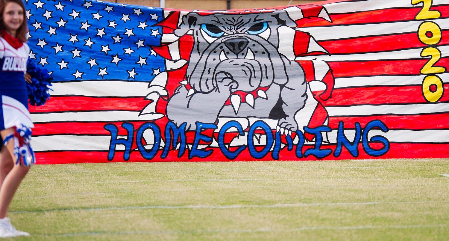 The weekly handmade banner just before the Bulldogs burst through it prior to taking on Queen City on Friday evening.
